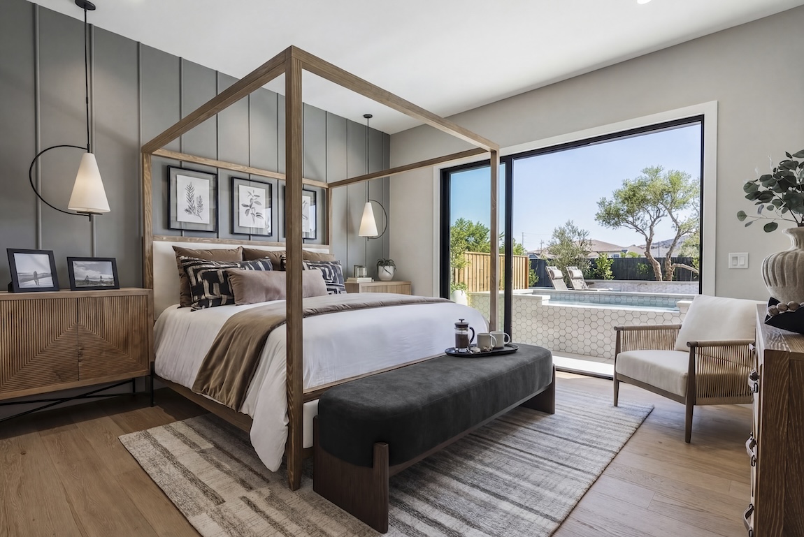 primary bedroom with sliding doors to the outdoor pool area