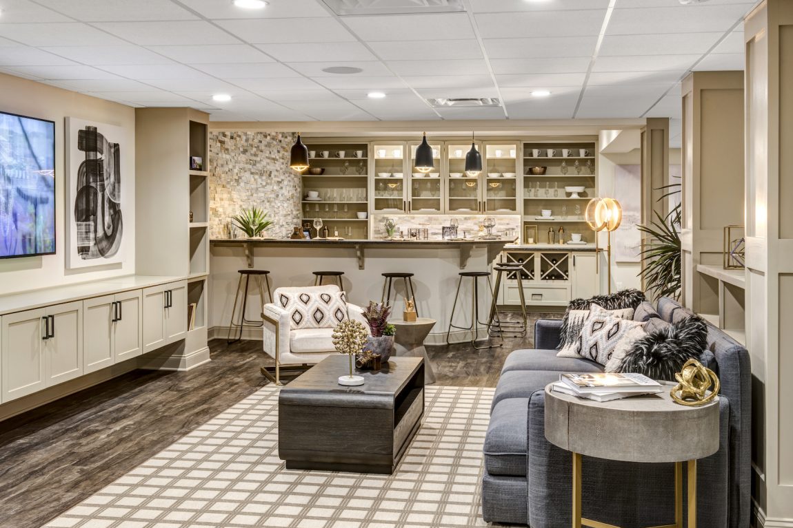 Luxury finished basement with lounge area and bar