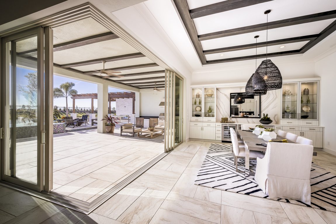 Luxury indoor-outdoor room with sliding glass doors