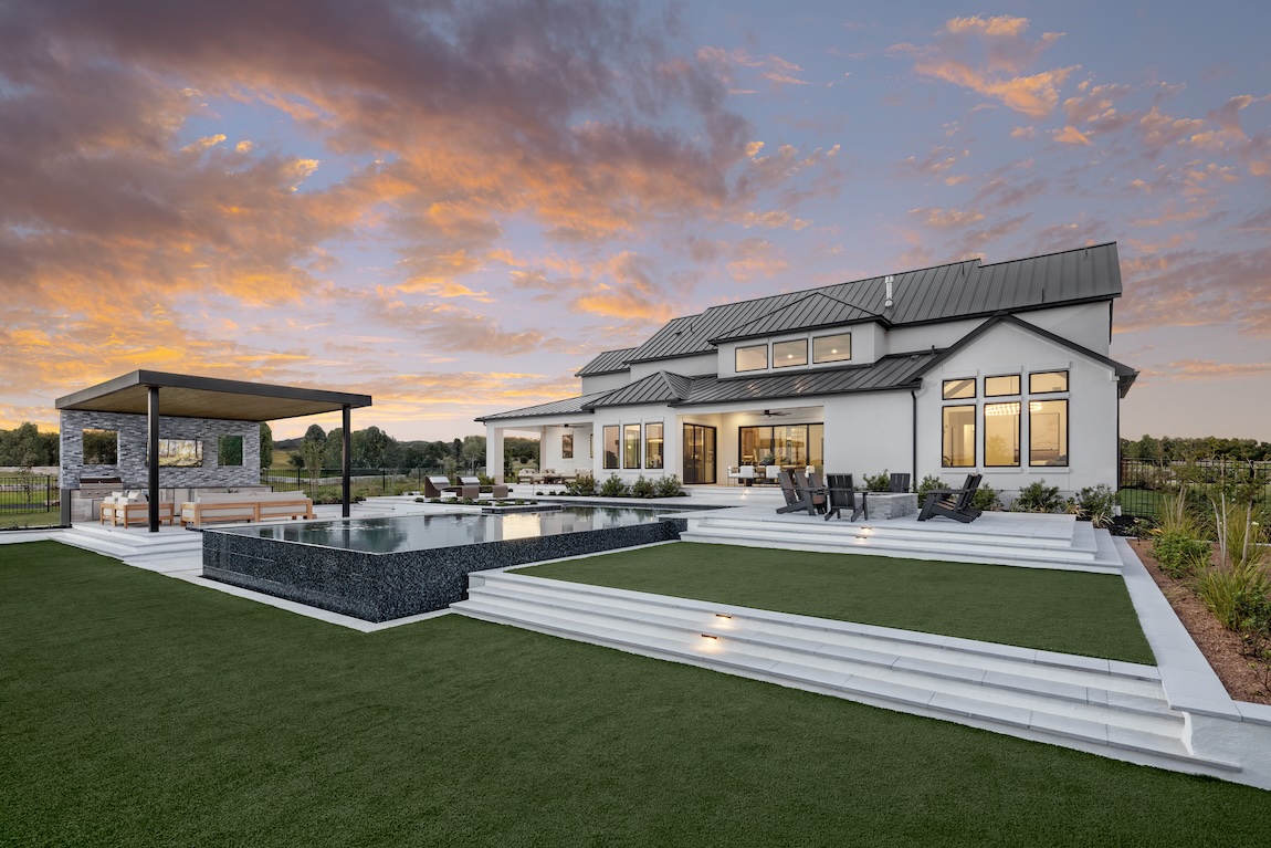 outdoor living space with pool and covered lounge area