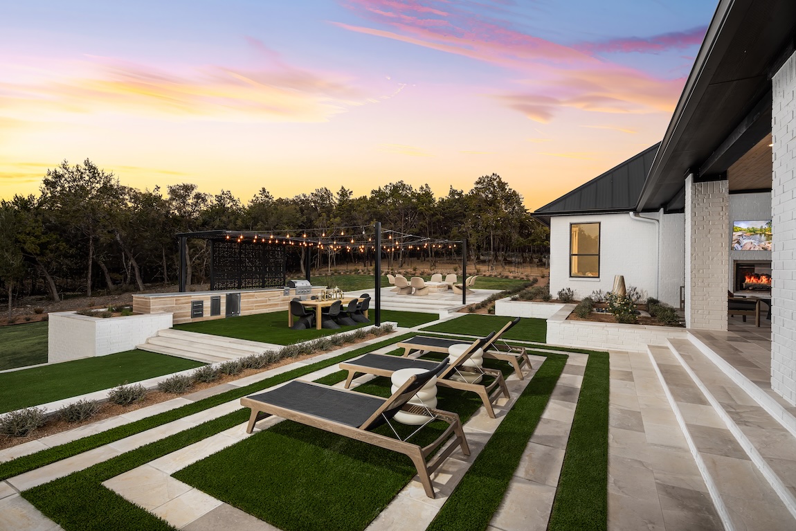 outdoor living space with string lights and seating areas