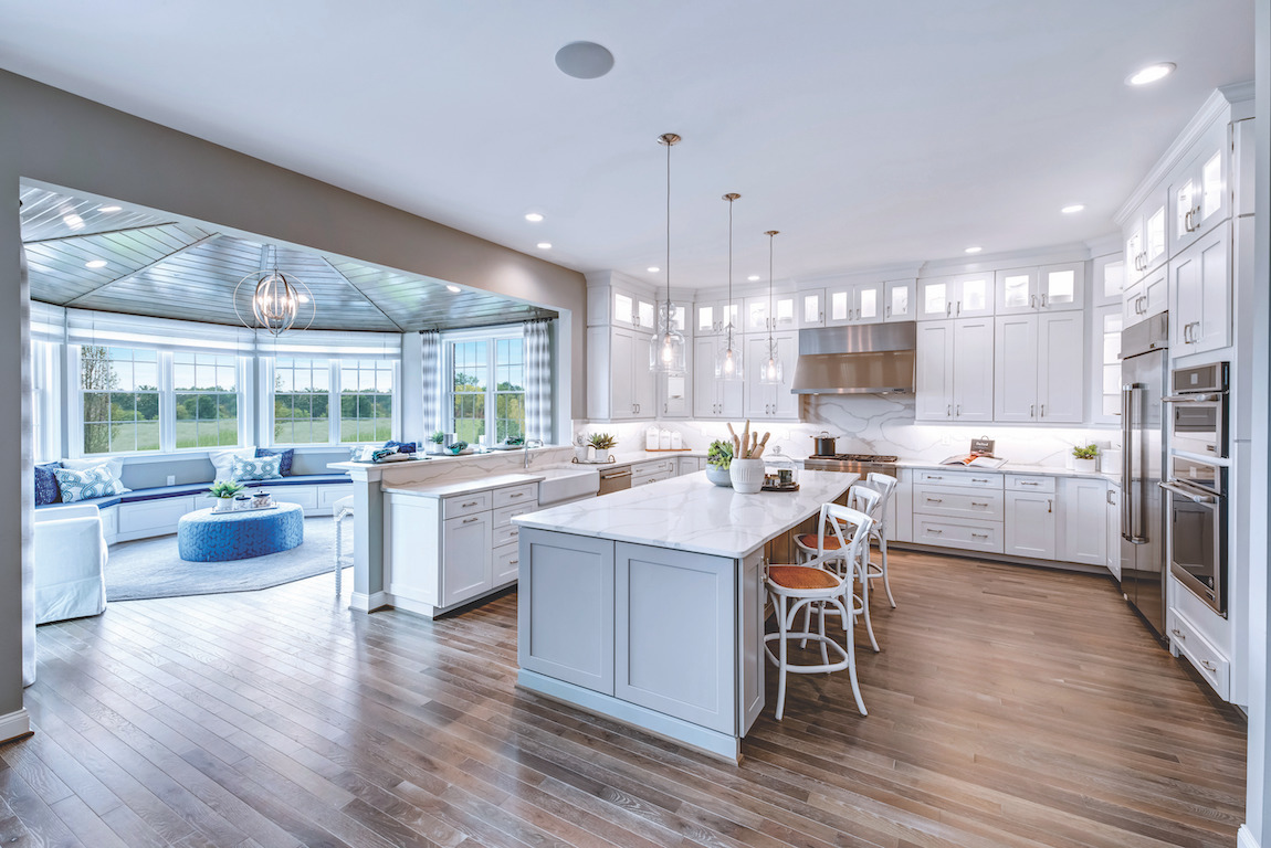 Kitchen layout featuring ample drawer and cabinet space and an accompanying sunroom