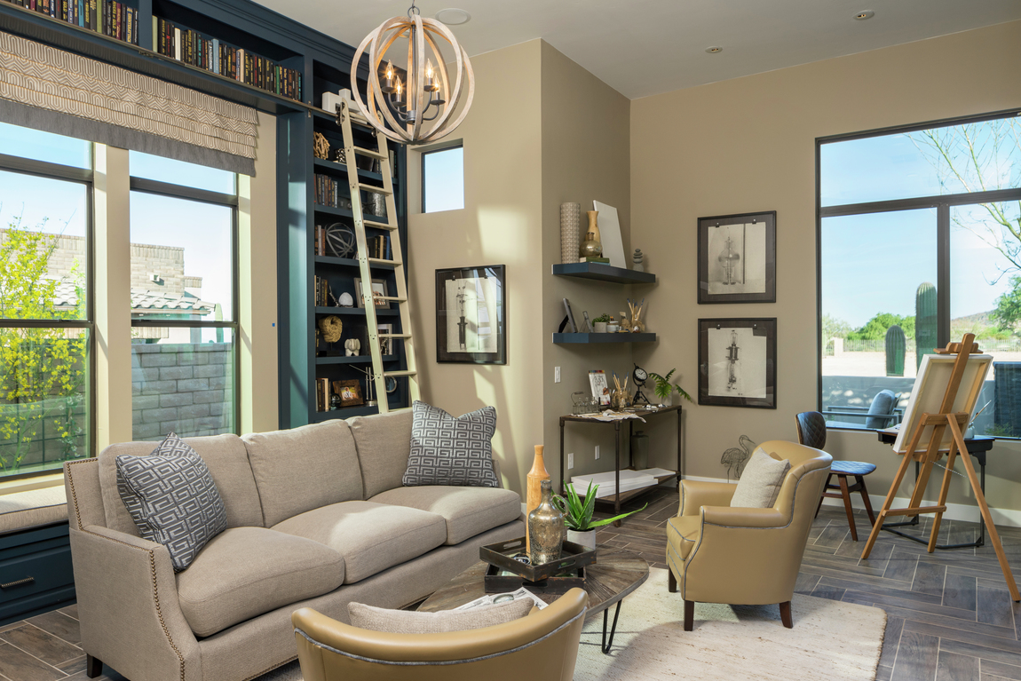 Creative space featuring bookcase with ladder