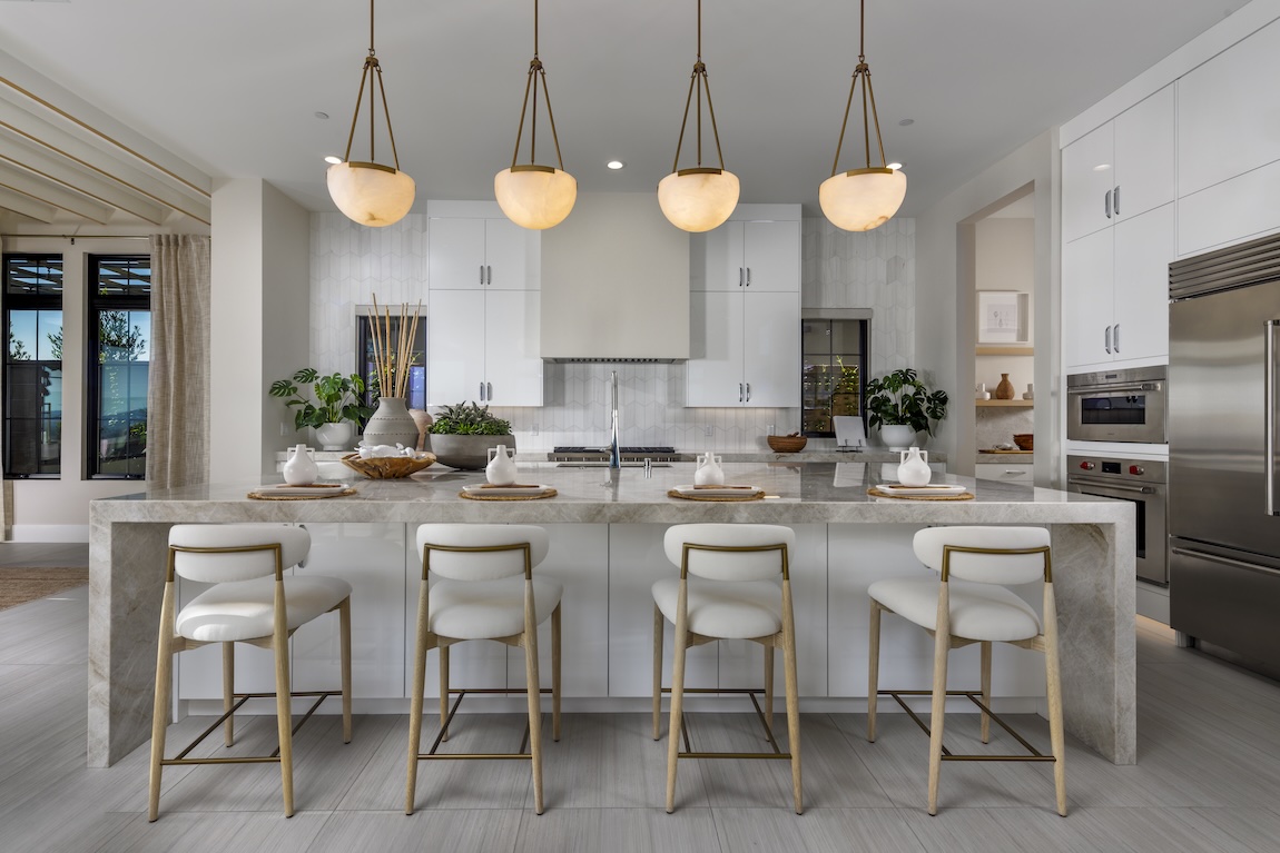 kitchen with white cabinetry and gold fixtures