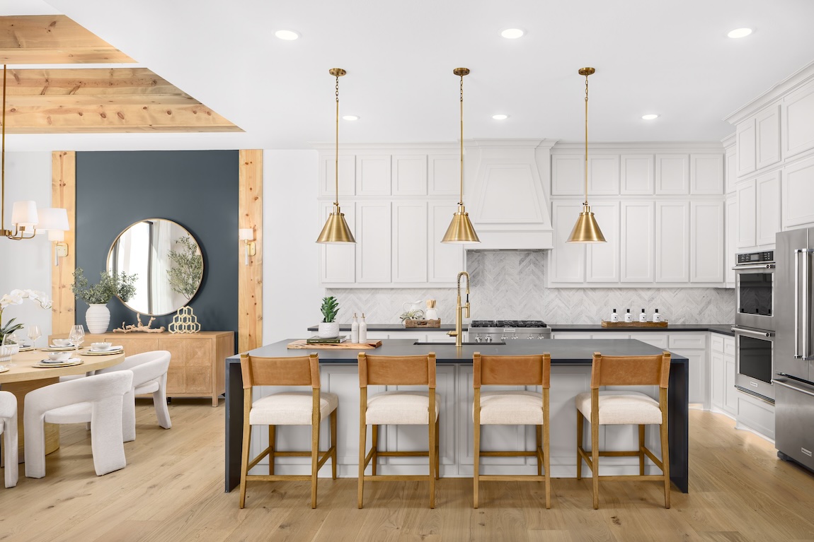 modern kitchen with white cabinetry and wooden accents