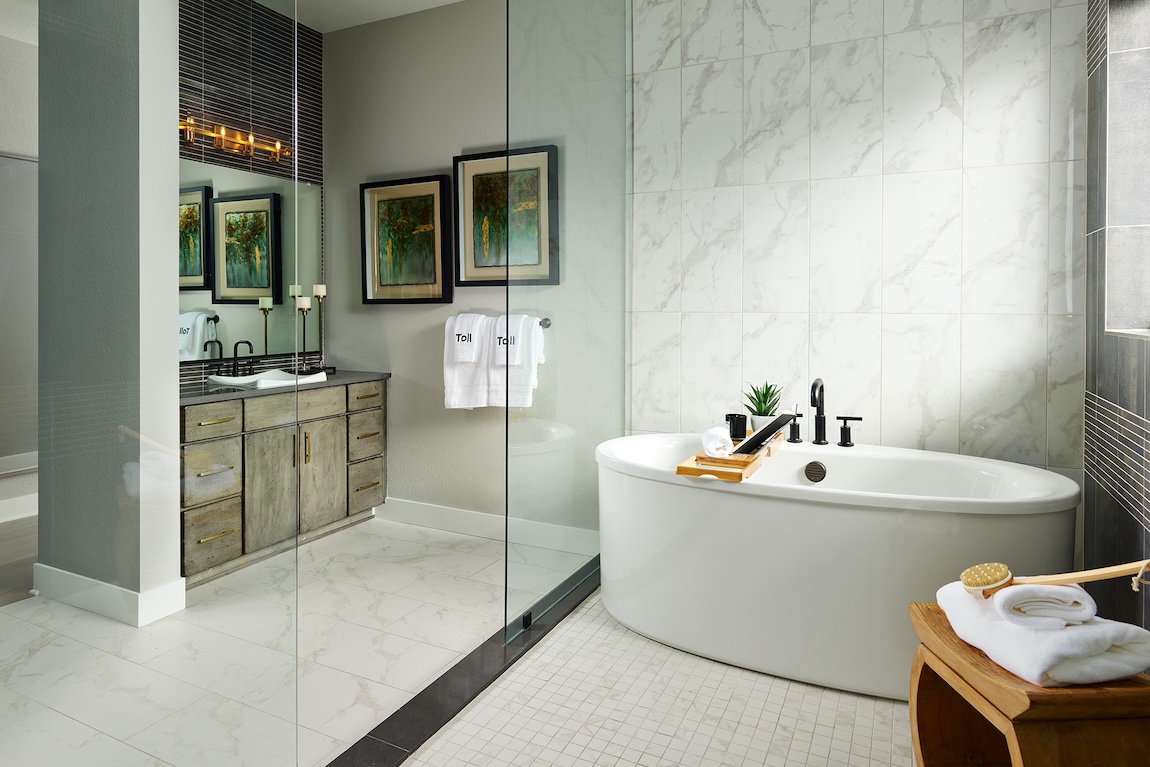 bathroom with freestanding tub and glass doors