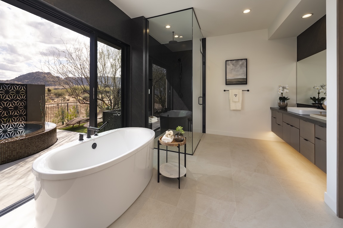 primary bathroom with sliding door to the outdoors behind a freestanding tub