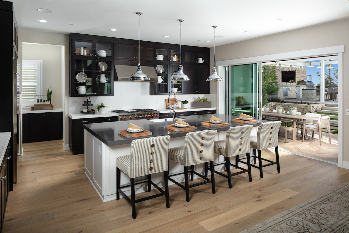 Kitchen in a new construction home with a sliding door that leads to an outdoor space.