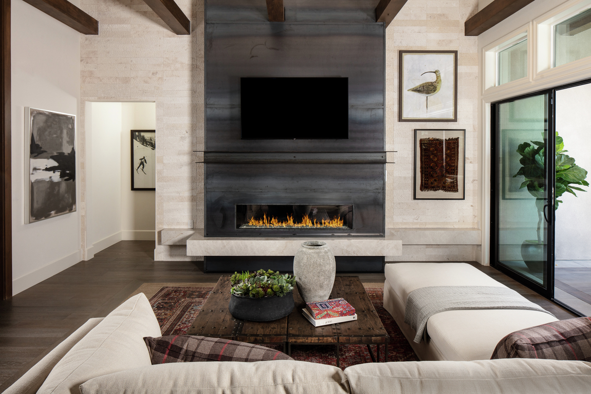 A contemporary fireplace in a small living room.
