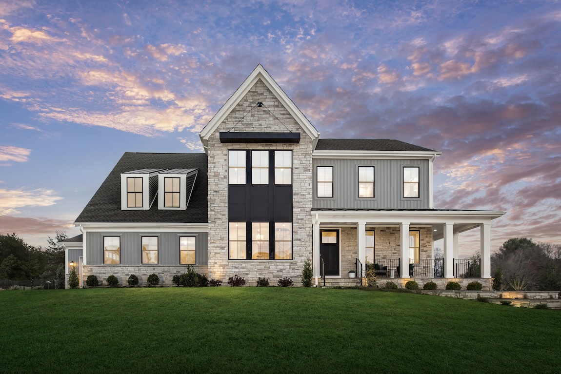 Modern farmhouse of a quick move-in home in Bethesda, MD with stone exterior accents