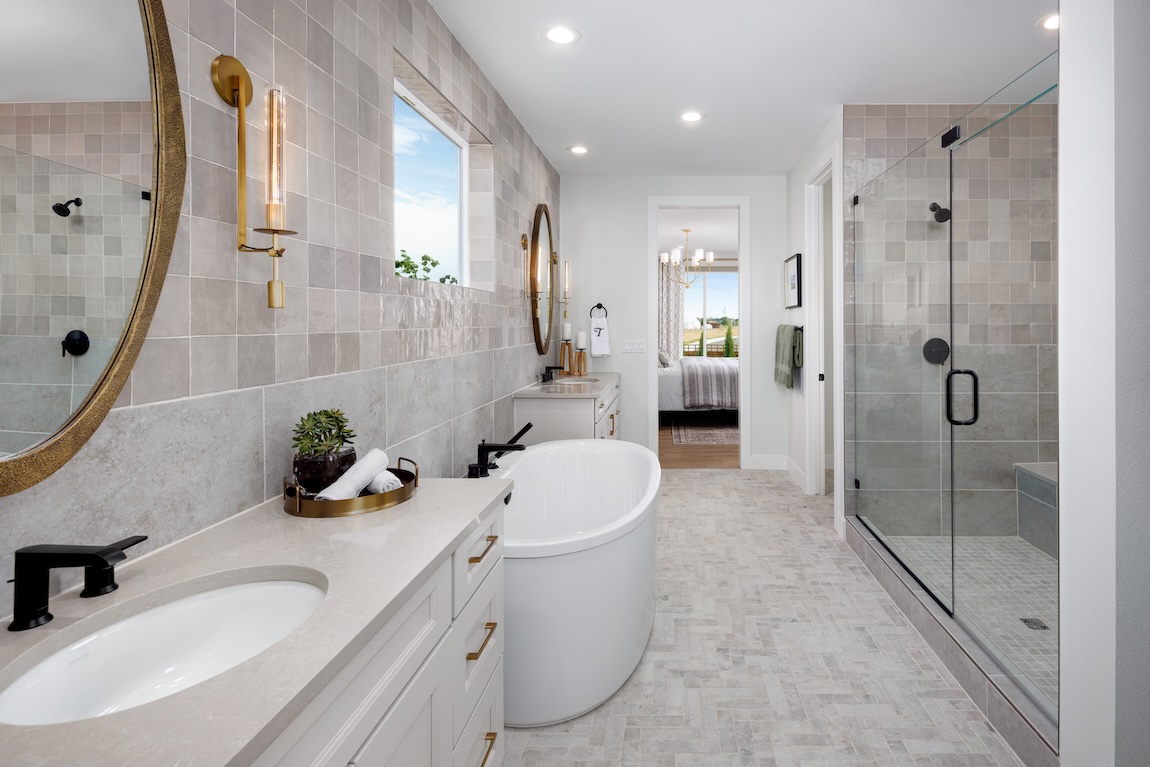 bathroom with dual vanity design and central tub