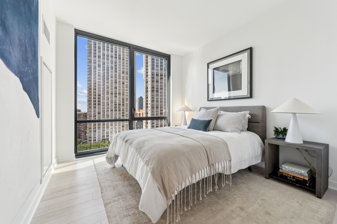 Luxury bedroom design overlooking New York City. 