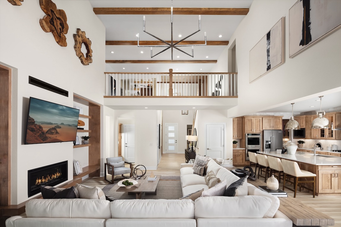 luxe two-story interior design featuring wood ceiling accents and modern fireplace in Castle Rock, Colorado