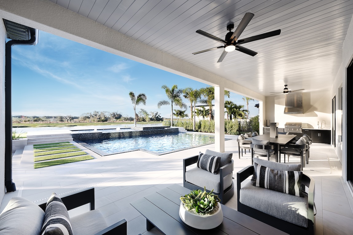 Resort-style outdoor dining area design nearby palm trees