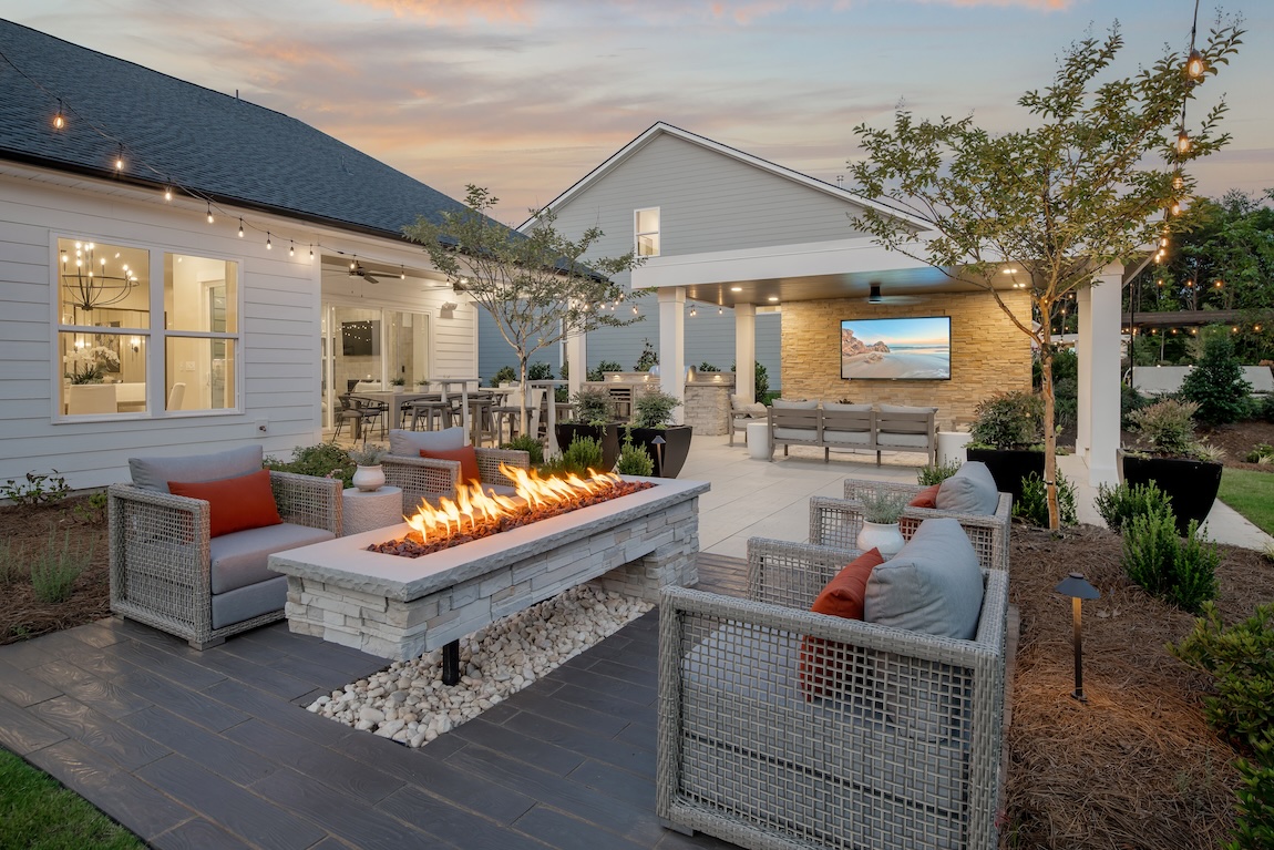 Luxury outdoor living space with modern fire pit and entertainment area