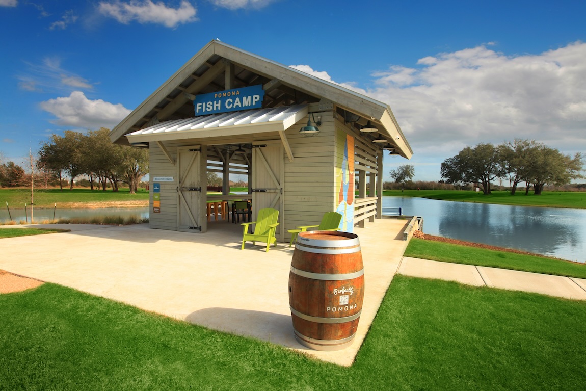 local lake with fishing area located at Pomona by Toll Brothers in Manvel, Texas