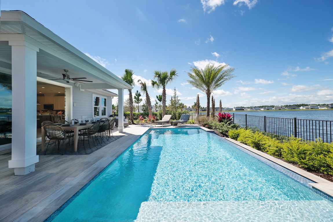 Coastal outdoor dining space with waterfront views