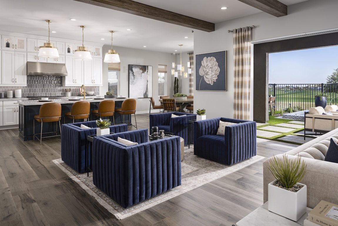 elegant open-concept interior featuring striking navy blue seating