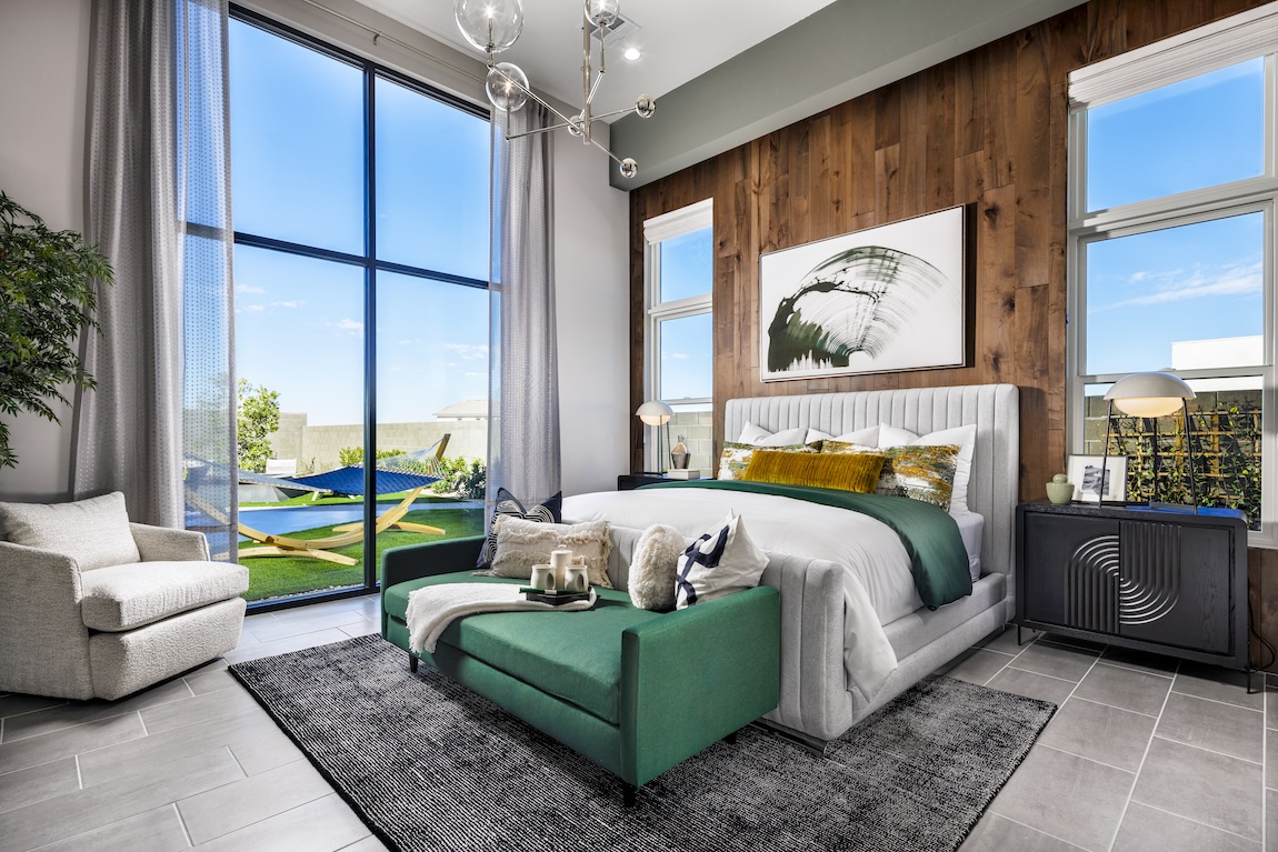 contemporary primary bedroom with tall ceilings and outdoor transition