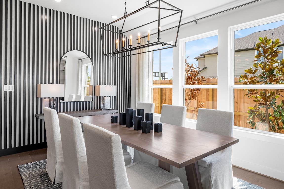 Modern dining room featuring fluted panel wall