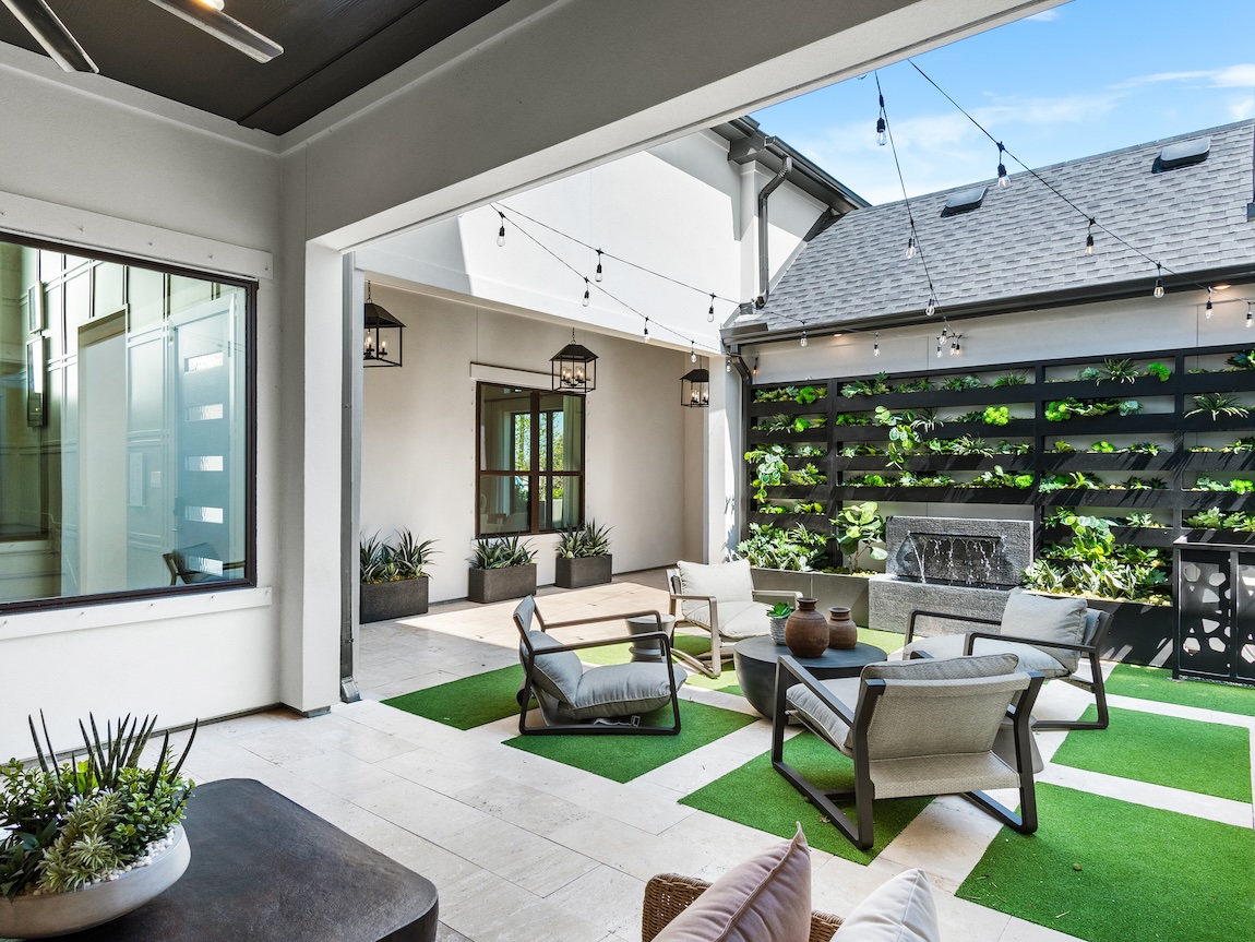 outdoor patio with garden wall and lounge area