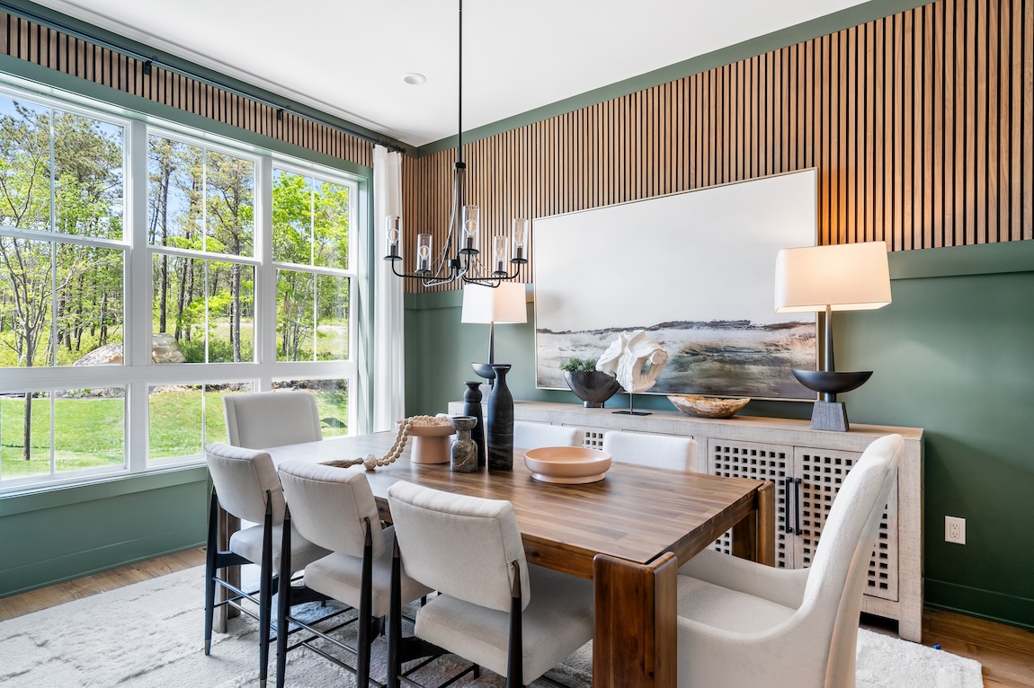 Vibrant dining room featuring accent wall