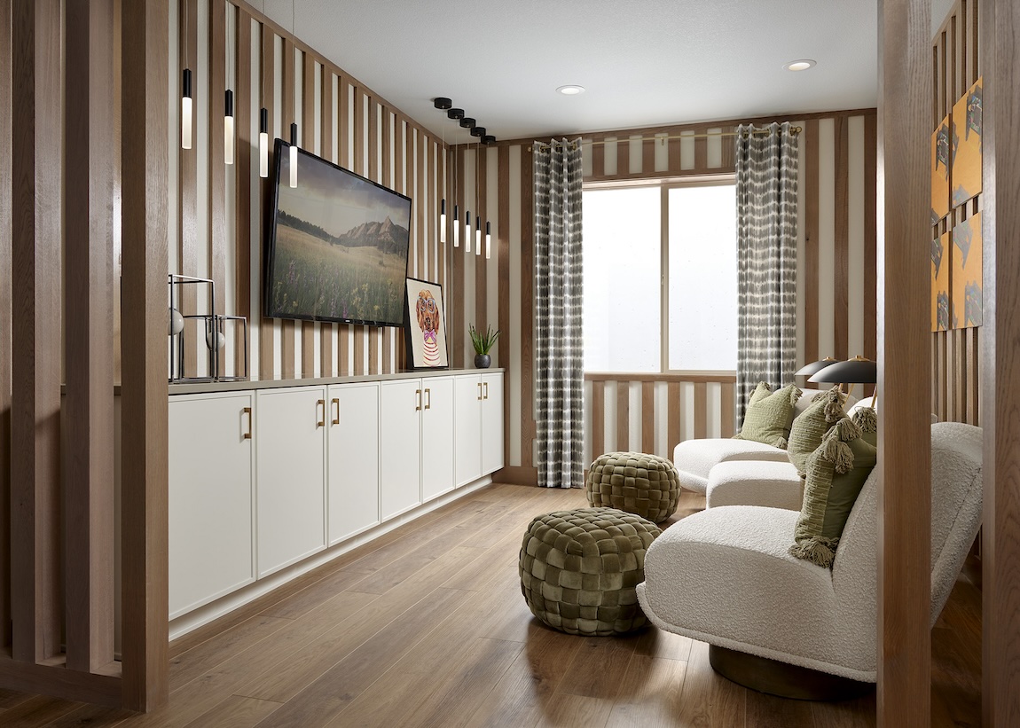 entertainment space highlighted by intricate fluted paneling