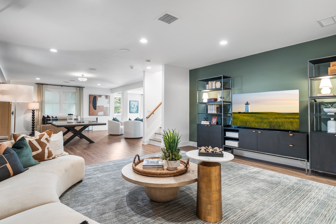 modern basement design featuring entertainment are, table tennis, and lounge