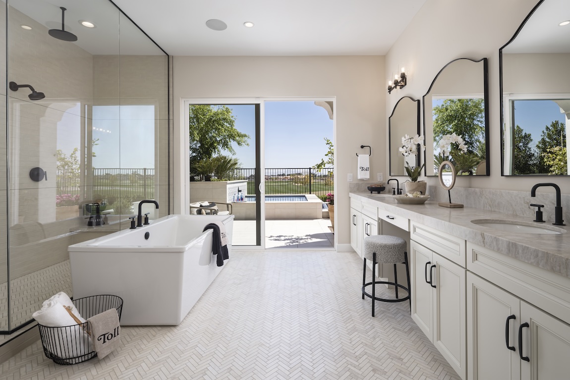 luxe primary bathroom with outdoor transition