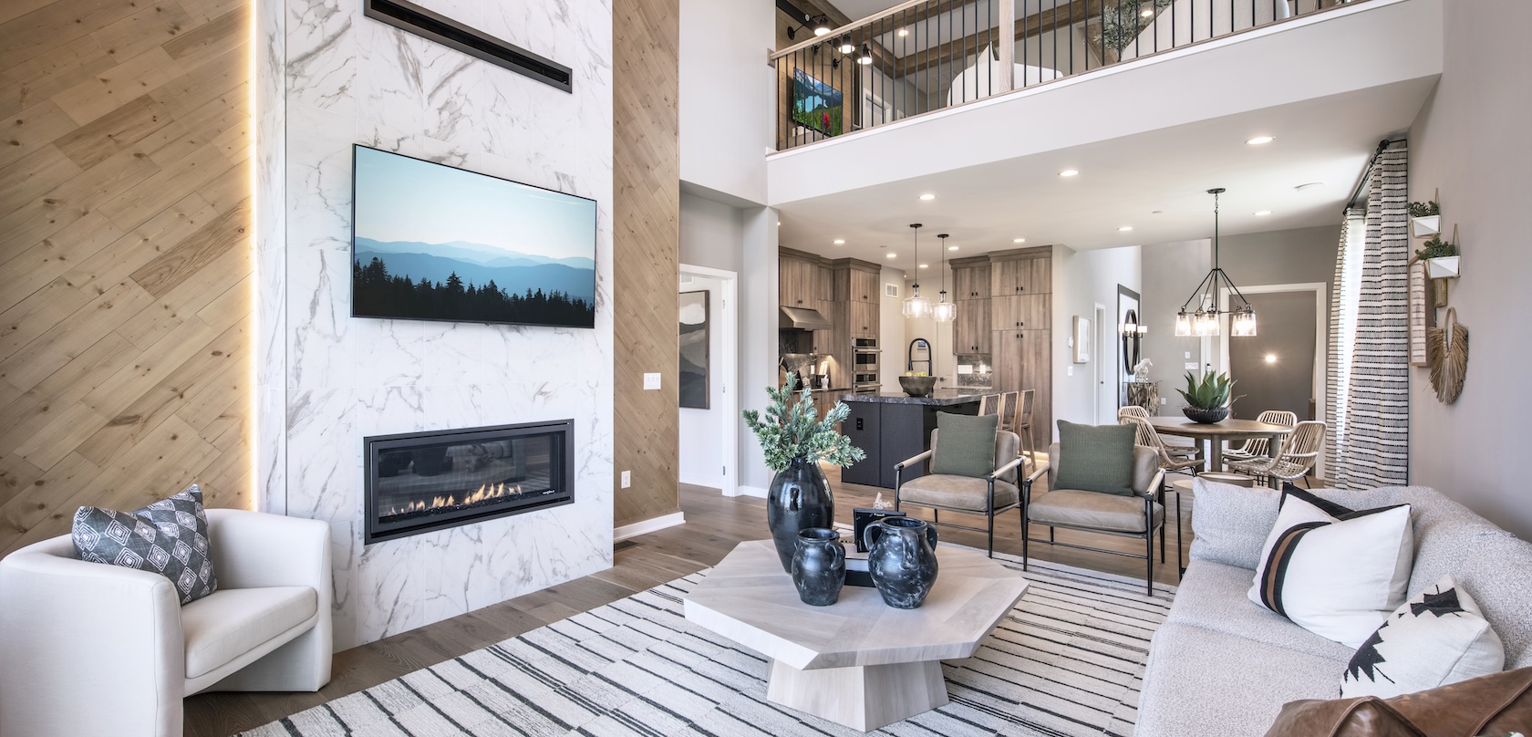 Luxury living room with marble two-story fireplace and wooden accents